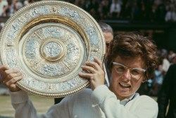 American tennis player Billie Jean King holds the winner's trophy after the Final of the Women's Singles tournament at Wimbledon, All England Lawn Tennis Club, London, July 1966.
