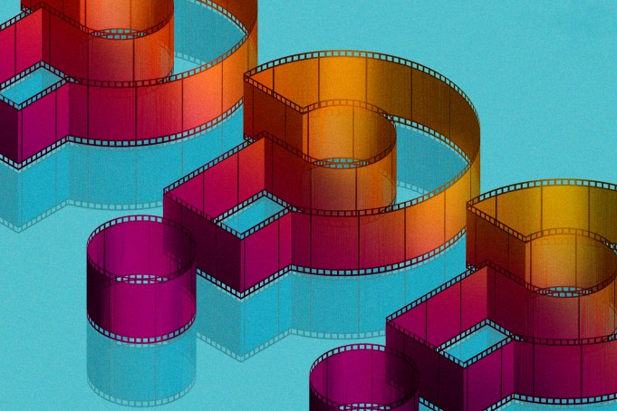 Question marks composed of film reels set against a blue background