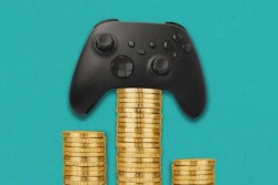 Video game controller sitting on top of a stack of coins