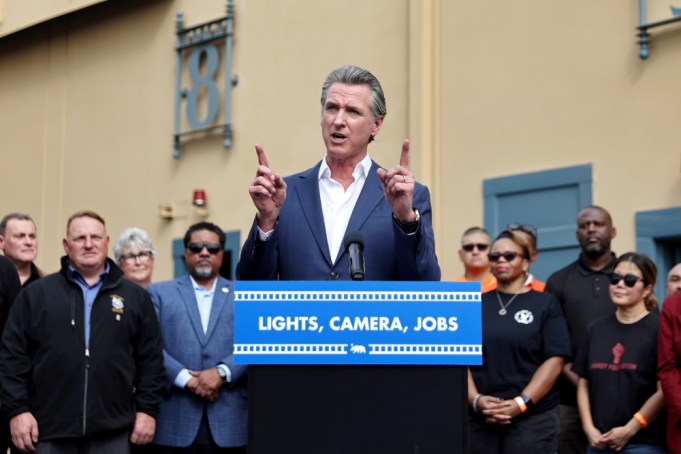 LOS ANGELES, CALIFORNIA - OCTOBER 27: California Governor Gavin Newsom speaks as Los Angeles Mayor Karen Bass (R) looks on during a press conference at Raleigh Studios unveiling a vast expansion of Californias Film and Television Credit Program on October 27, 2024 in Los Angeles, California. Their proposal would expand the program to $750 million annually, a major increase from the $330 million currently allocated, amid sluggish film and TV productions in Hollywood and across California. (Photo by Mario Tama/Getty Images)