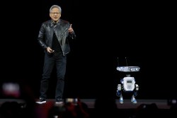 SAN JOSE, CALIFORNIA - MARCH 18: Nvidia CEO Jensen Huang delivers the keynote address with a robot during the Nvidia GTC 2025 at SAP Center on March 18, 2025 in San Jose, California. The annual Nvidia GTC conference runs through March 20th.  (Photo by Justin Sullivan/Getty Images)